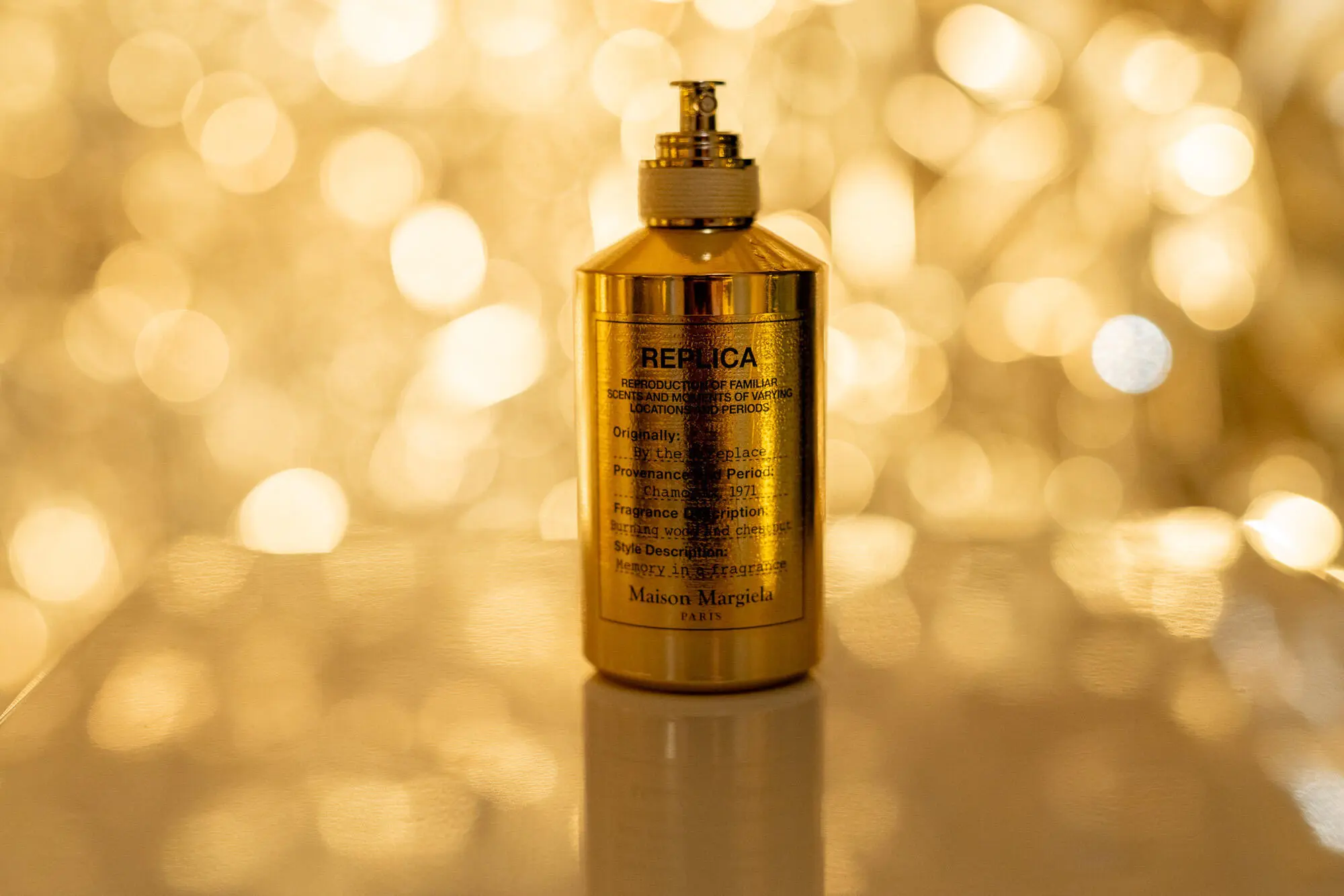Produktfoto von einem goldenen maison margiela fragrances Parfum Flasche
